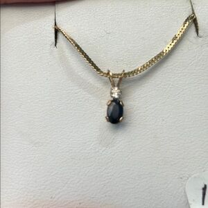 146130 10k Blue/white Topaz Pendant